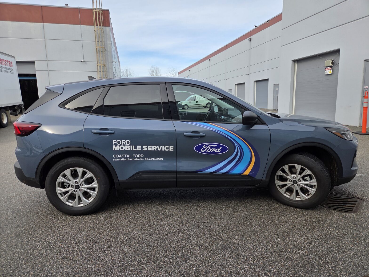 Custom vehicle graphics Burnaby installed on a Coastal Ford mobile service vehicle.