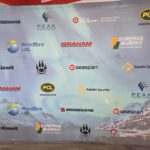 Tension fabric media walls Vancouver displaying sponsor logos for a local corporate event.