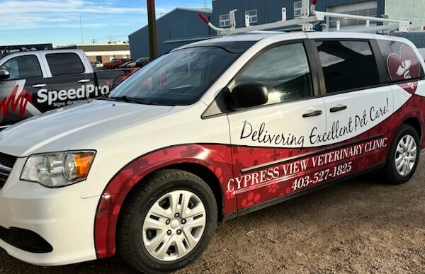 Van outside business on street