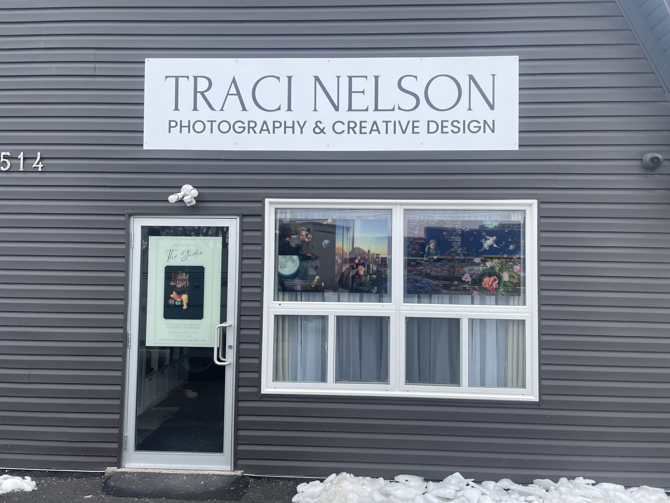 Storefront sign for Traci Nelson Photography in St. Catharines, ON.